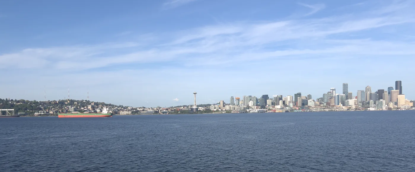Arriving at Seattle by ferry — Space Needle and city skyline from the water